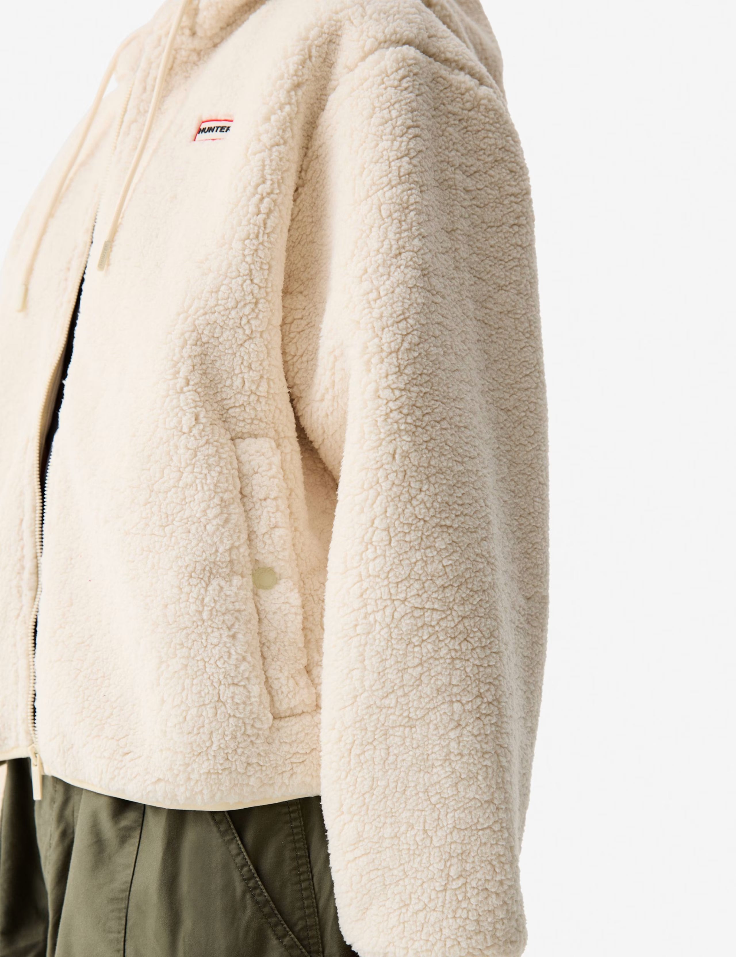 Valkoinen fleece takki lähikuva