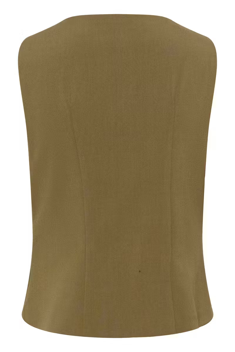 Tämä naisellinen hihaton toppi yhdistää modernin ilmeen ja arjen käyttömukavuuden. Epäsymmetrinen nappikiinnitys ja kauniisti istuva rypytetty etuosa tuovat paidalle hauskaa ilmettä.