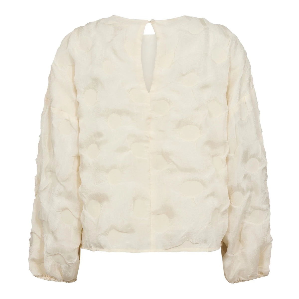Co’Couture FeronCC Structure Blouse on offwhite-pusero teksturoidulla pinnalla. Väljä malli, joustavat hihansuut ja nappikiinnitys niskassa.