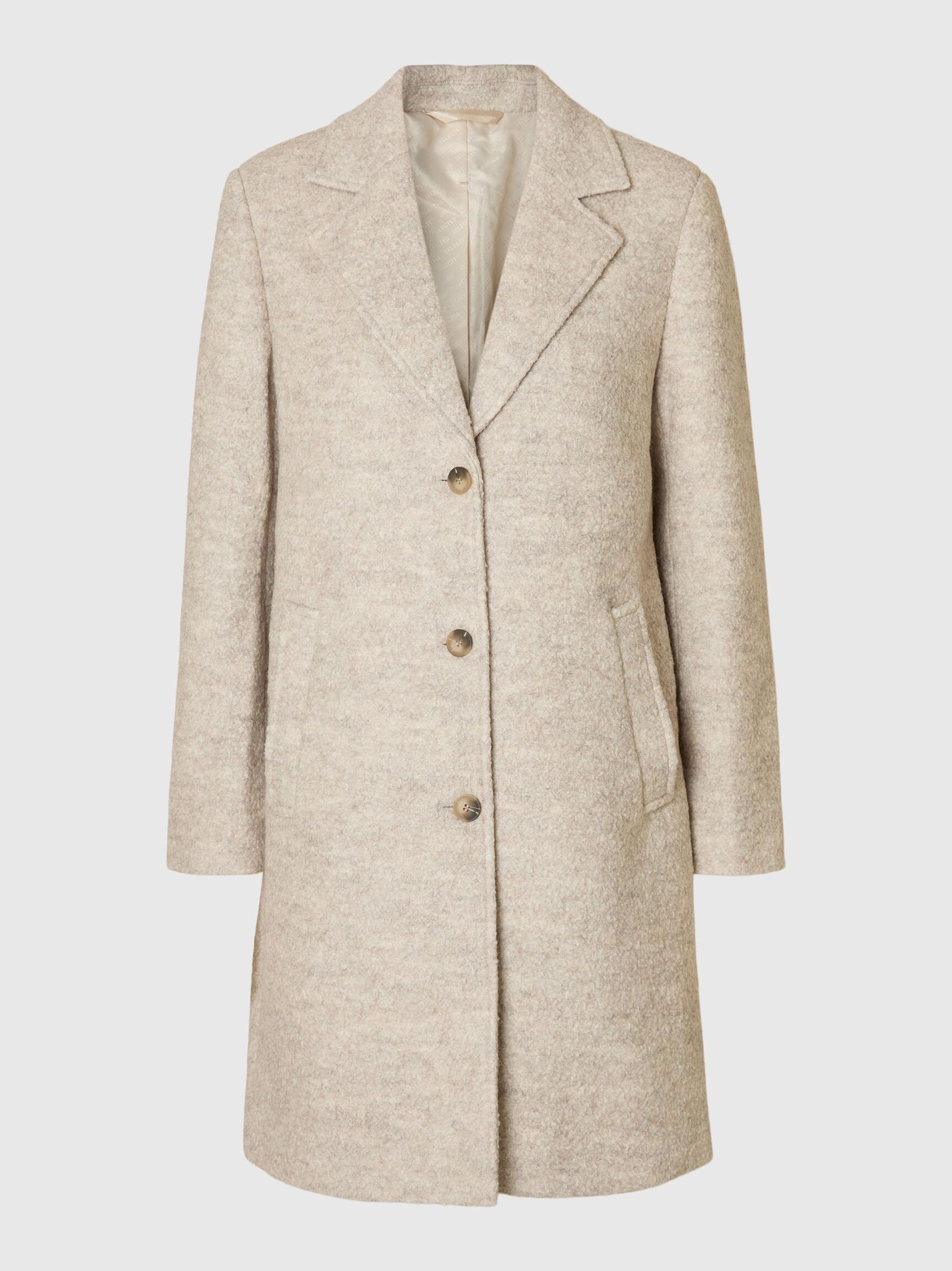 Tämä villasekoitteinen bouclé-takki on ajaton klassikko, joka kuuluu jokaisen naisen vaatekaappiin. Kauniisti teksturoitu bouclé-kangas tuo takkiin elävyyttä ja hienostuneen ilmeen, samalla kun kaunis leikkaus antaa kokonaisuudelle ryhtiä ja eleganssia.